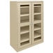 A sand Tennsco storage cabinet with C-Thru doors.