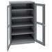 A dark gray metal Tennsco storage cabinet with open doors and open shelves.