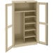 A tan metal Tennsco combination cabinet with open C-Thru doors.