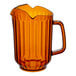 An amber SAN plastic pitcher with a handle and 3 spouts.