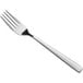 An Acopa stainless steel dinner fork with a silver handle.