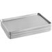 A stack of silver Baker's Mark aluminum bun/sheet pans on a counter.