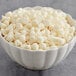 A bowl of HERSHEY'S Premier White Vanilla Baking Chips.