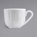 A Tuxton bright white espresso cup with a white handle.