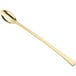 A Visions gold plastic tasting spoon with a long handle.