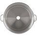 A close-up of a stainless steel bowl with a handle.