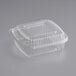 A clear World Centric compostable hinged clamshell container with a lid.