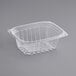 A close up of a World Centric clear rectangular deli container with a lid.