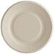 A close-up of a World Centric 6" compostable fiber plate with a ribbed edge.