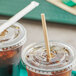 Two cups of coffee with World Centric Kraft paper straws on a tray.