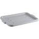 A gray plastic utility lid on a white foam tray.