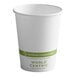 A white World Centric compostable paper hot cup with a green label.