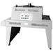 A Sealer Sales stainless steel shrink tunnel machine on wheels.