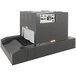A large grey Sealer Sales shrink tunnel machine with buttons and switches.