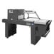 A large grey Sealer Sales shrink tunnel and L-bar sealer with white buttons.