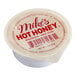 A Mike's Hot Honey 1 oz. dip cup on a counter.