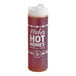 A 24 oz. squeeze bottle of Mike's Hot Honey infused with chilies.