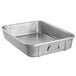 A silver rectangular aluminum Vollrath roaster pan with handles.