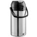 A Bunn stainless steel lever action airpot with a black lid.