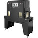 A large black Sealer Sales shrink tunnel machine with an open door.