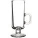 A clear glass Libbey Irish coffee mug with a handle.