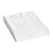 A folded white CleanRest PRO Max pillow protector on a white surface.