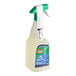 A spray bottle of Comet disinfecting bathroom cleaner with a green and white label.