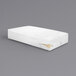 A white box spring encasement for a mattress.