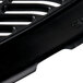 A black plastic urinal mat with a grille pattern.