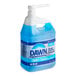 A blue and white Dawn Professional container of dish detergent with a white label and a pump on a counter.