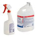 A white jug of Febreze Professional Sanitizing Fabric Refresher with a red and blue label and a red spray bottle.