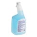 A close-up of a blue plastic bottle of Spic and Span glass cleaner with a white label and cap.
