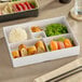 A white American Metalcraft bento box tray with sushi and rice.