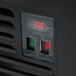 An Avantco black refrigerated air curtain merchandiser with a customizable panel on the front.