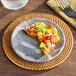 An American Metalcraft gray marble melamine coupe plate with food on it.