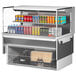 A Turbo Air drop-in refrigerated display case with drinks and cans on a shelf.