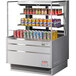 A Turbo Air horizontal refrigerated open curtain merchandiser with cans of soda on shelves.