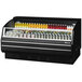A Turbo Air black refrigerated display case with different drinks and beverages.