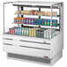 A white Turbo Air horizontal refrigerated open curtain merchandiser with drinks and cans.