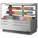 A Turbo Air stainless steel horizontal refrigerated display case with drinks and beverages on shelves.