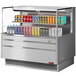 A Turbo Air stainless steel horizontal refrigerated open curtain merchandiser with drinks in it.