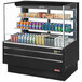 A Turbo Air black horizontal refrigerated open curtain merchandiser with drinks and cans inside.