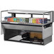 A Turbo Air drop-in refrigerated display case filled with drinks on a shelf.