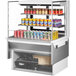 A white Turbo Air drop-in refrigerated display case with cans on shelves.