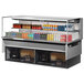 A Turbo Air drop-in refrigerated display case with drinks and beverages on shelves.