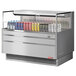 A Turbo Air stainless steel horizontal refrigerated curtain merchandiser with drinks inside.