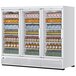 A white Turbo Air refrigerated glass door merchandiser full of drinks.