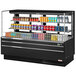 A black Turbo Air horizontal refrigerated open curtain merchandiser with drinks on shelves.