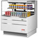 A Turbo Air white refrigerated open curtain merchandiser with cans of soda on the shelf.