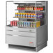 A Turbo Air stainless steel horizontal refrigerated curtain merchandiser filled with cans of beer.